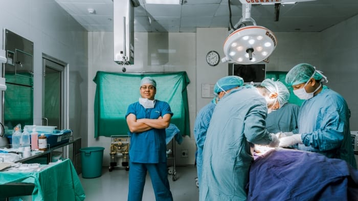 Consultant colorectal surgeon discussing a treatment plan with a patient in a Dubai clinic