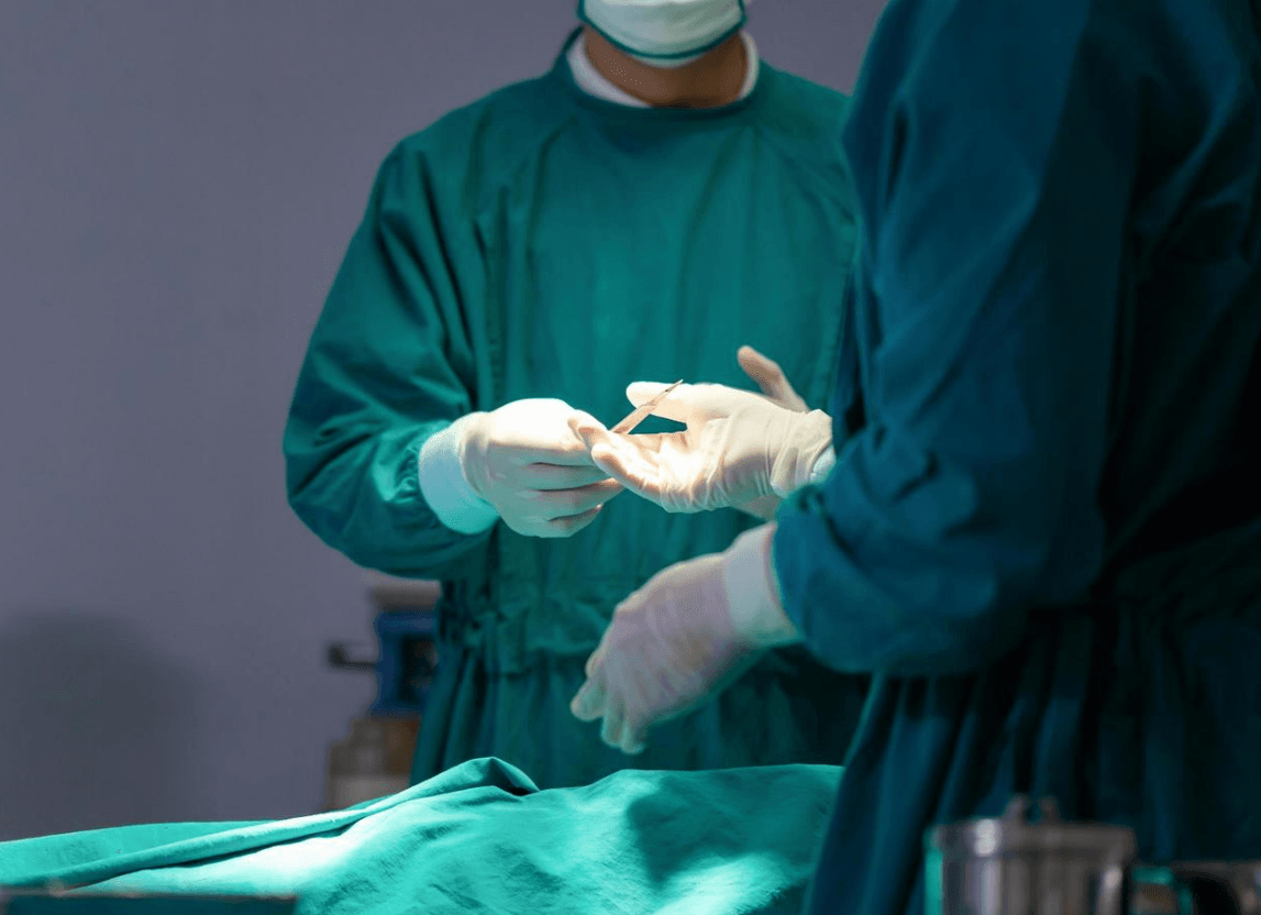 Specialist reviewing diagnostic scan results on a screen before cancer staging