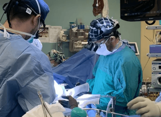 Doctor discussing digestive symptoms with a patient during a clinic consultation